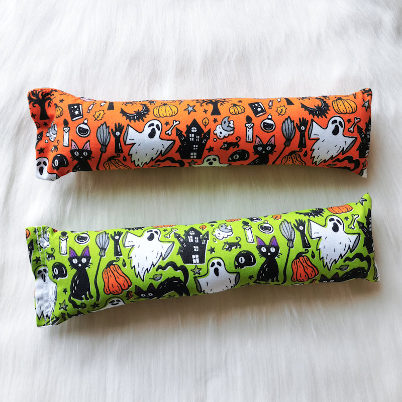 Halloween themed catnip cat toy kickers, 10 inches long in various Halloween fabrics, filled with strong smelling catnip