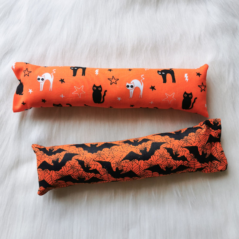 Halloween themed catnip cat toy kickers, 10 inches long in various Halloween fabrics, filled with strong smelling catnip