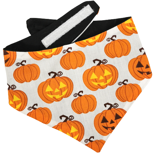 Halloween pet bandana for dogs or cats with scary pumpkin faces on in orange