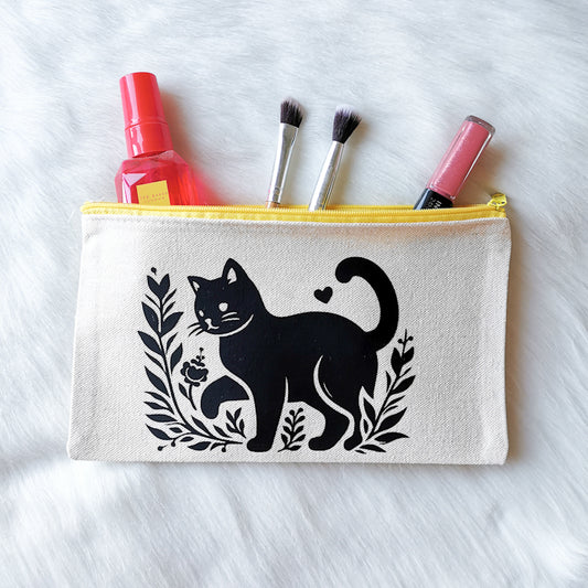 photo shows an accessory or make-up pouch which depicts an adorable cat walking through a field, the pouch is spacious enough to fit make-up in and would make the perfect gift for any cat lover or crazy cat lady