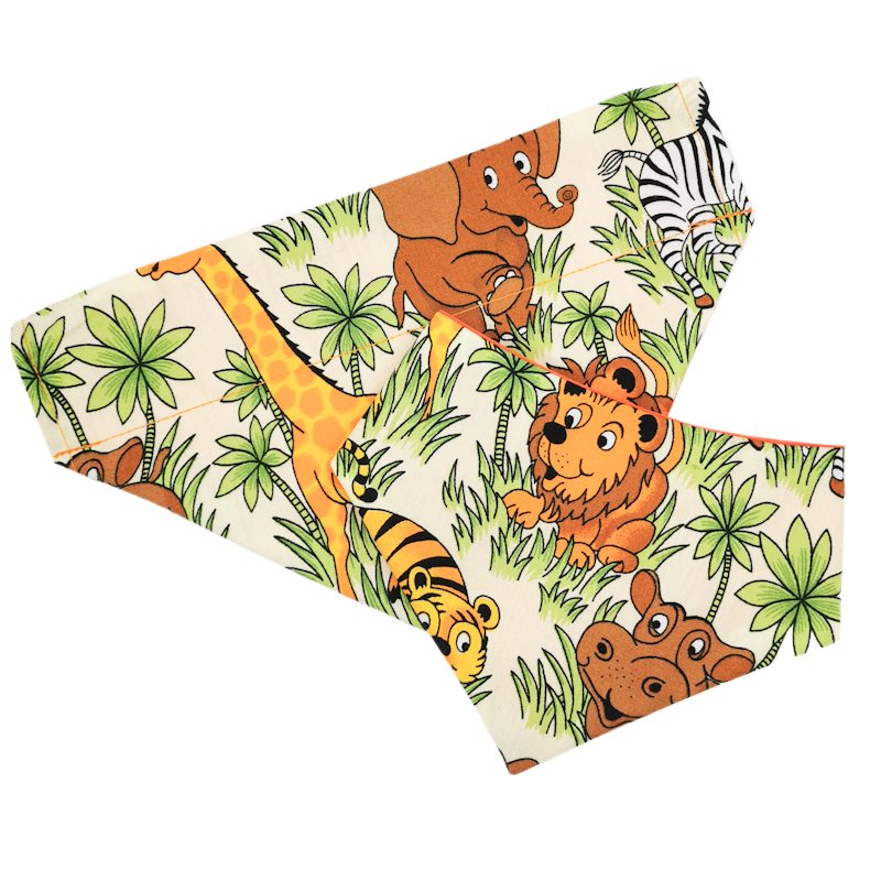 photo shows both an over the collar and a round neck pet bandana in the safari animals fabric, the bandanas are stylish and easy to wear and would make a great addition to a pet instagram photo shoot