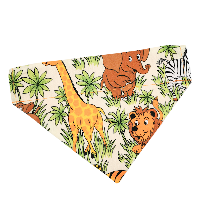 photo shows an over the collar pet bandana with a beige background and various safari animals on, the bandana is made from high quality, durable materials and is expertly sewn, the bandana would make a great gift for any pet parent