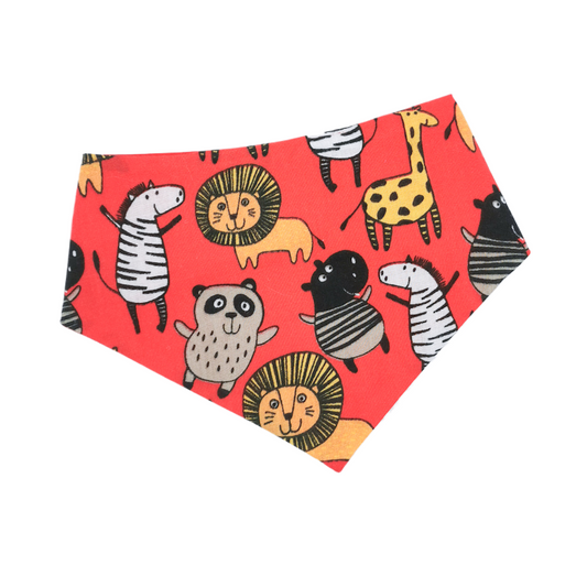 photo shows a round neck pet bandana which has a red background and various safari animals on, the bandana is made from high quality fabric which is durable and easy to clean, the bandana is cute and would make a great gift for any cat or dog owner