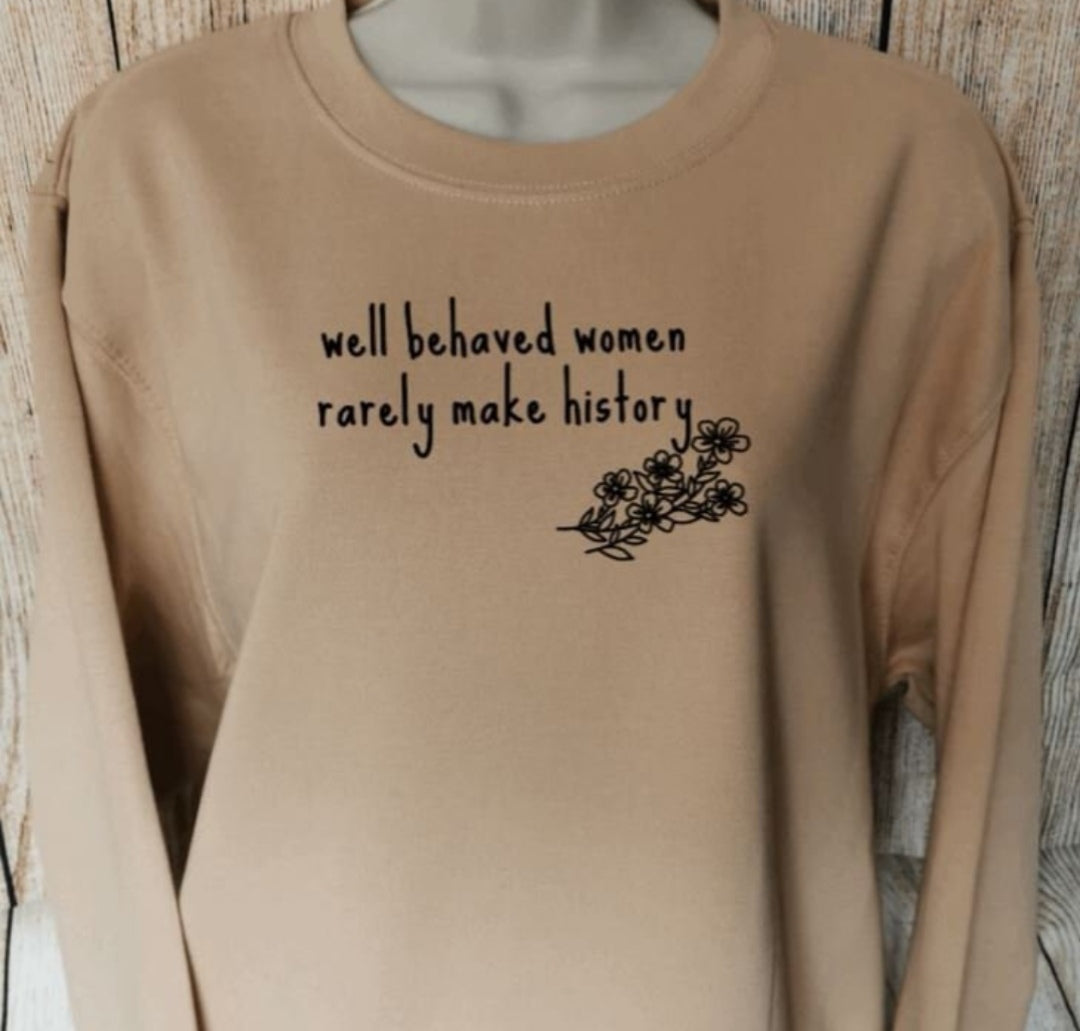 a sweatshirt in the colour nude for feminists which has the words well behaved women rarely make history on