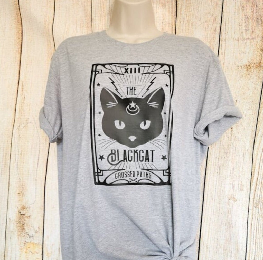 a t-shirt which has a tarot card on it which has a black cat on, it says the black cat crossed paths, this top is a great gift for cat lovers and witchy women alike