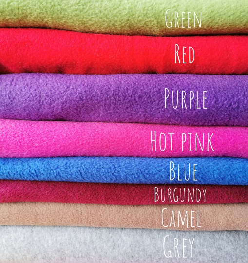 Picture shows the blanket options, green, red, purple, hot pink, blue, burgundy, camel and grey