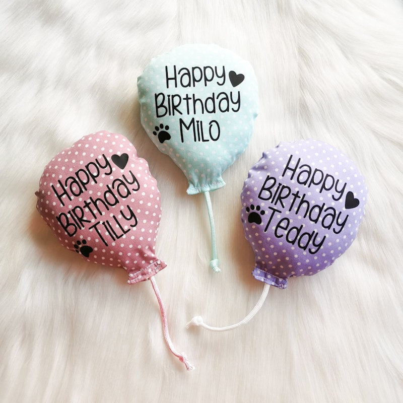 Catnip Cat toys made in the shape of birthday balloons with "Happy Birthday" on them with the cats name