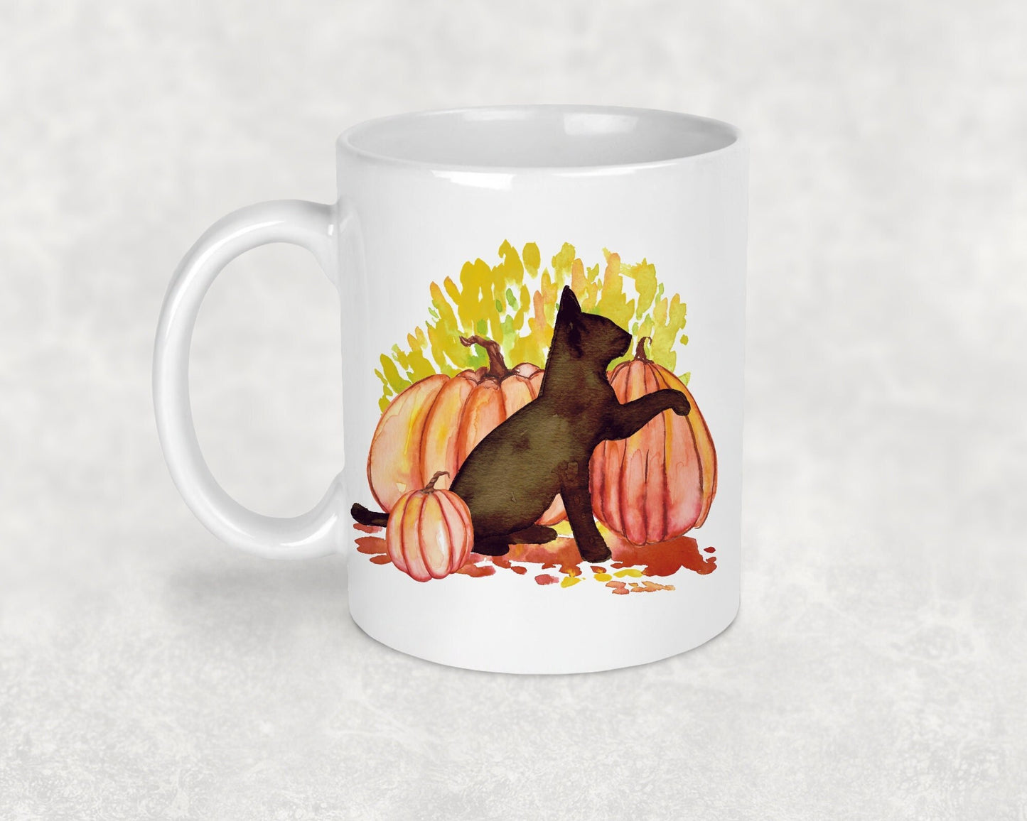 Photo shows an adorable cat mug which shows a black cat amidst pumpkins, setting the perfect Halloween scene, this mug would be a great gift for any cat lover or spooky person 