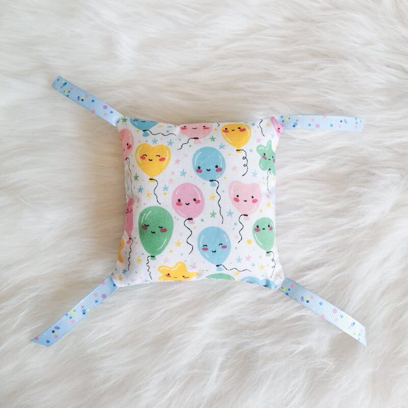 Catnip Cat Toy Birthday pillows with ribbons made from birthday themed fabric and stuffed with strong smelling catnip